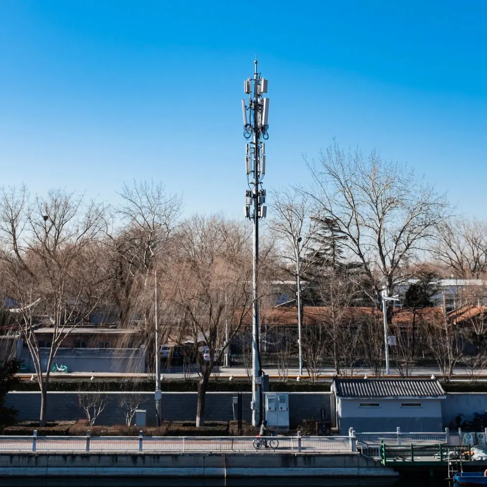 A local telecommunications installation among trees and homes